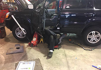 Technician Under a Car